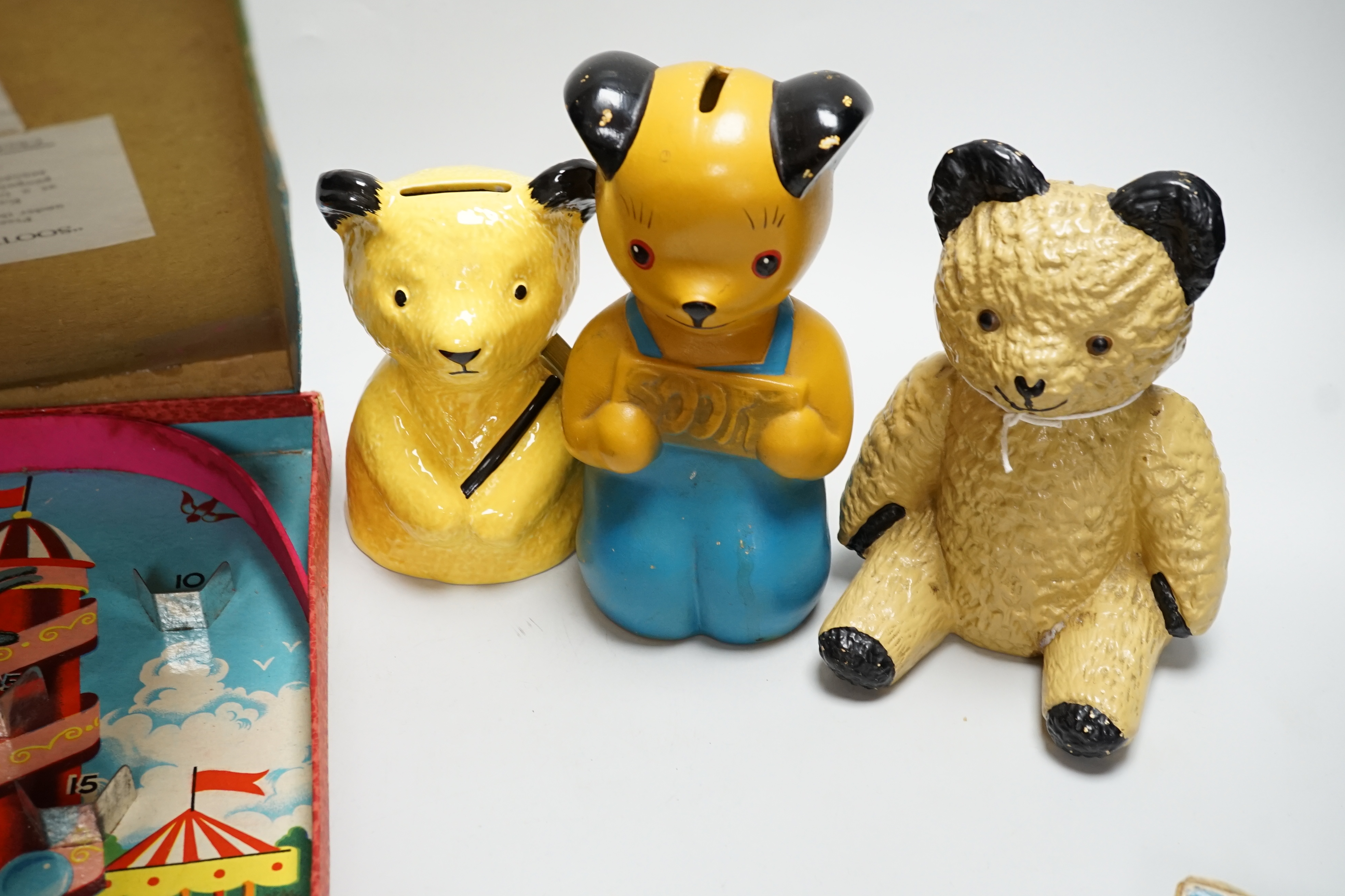 Three Sooty money boxes and two Sooty games and cards